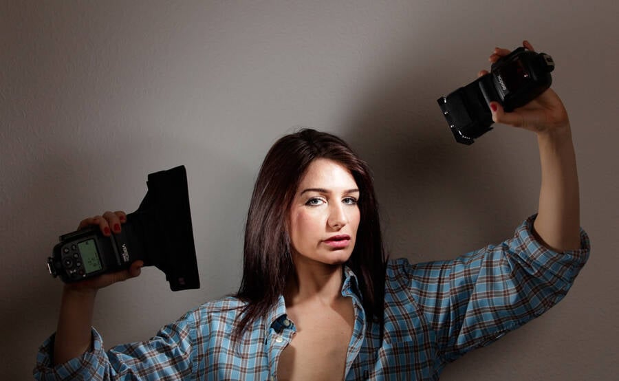 photographer Ray Barton studio modelling photo. shot with flash units held by the model wirelessly triggered.