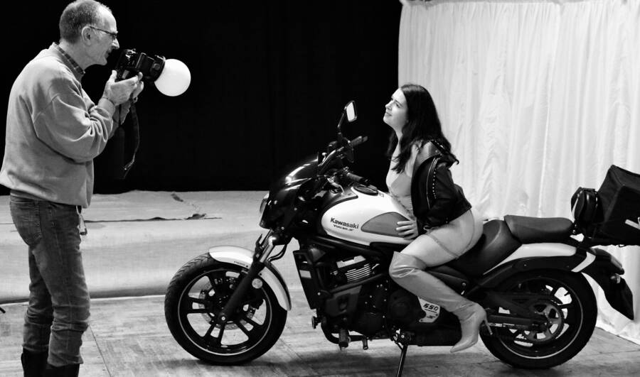 photographer Xbikerpete glamour modelling photo. belle on bike with tog.