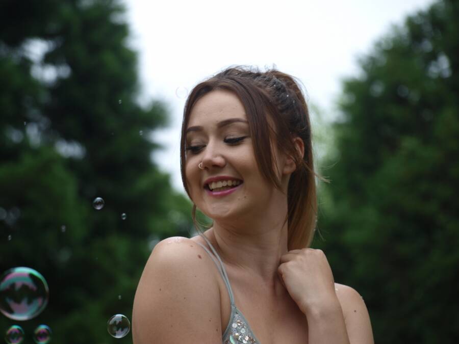 photographer Baron Michael cosplay modelling photo taken at Norfolk with Hollie. young woman entranced by bubbles.