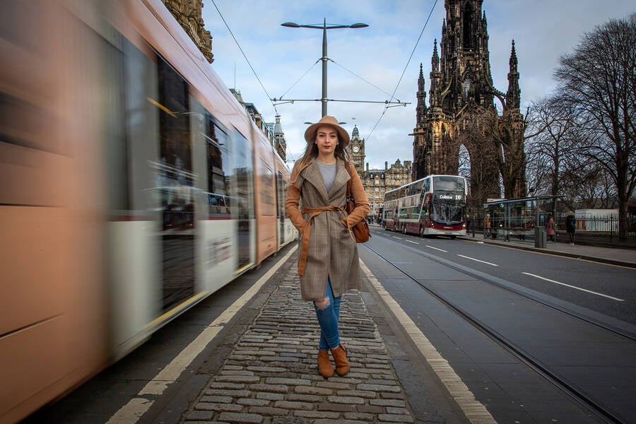 photographer CautherPhotography uncategorized modelling photo. chloe on princes st edinburgh as the tram was going past i used a slow shutter speed to get the sense of movement.