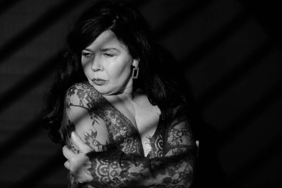 photographer tug portrait modelling photo. first attempt at a noir portrait    single godox s60 one of the standard godox gobos in a projection attachment slightly defocussed    trix 400 film simulation in dxo photlab with a bit of added grain no other post pr