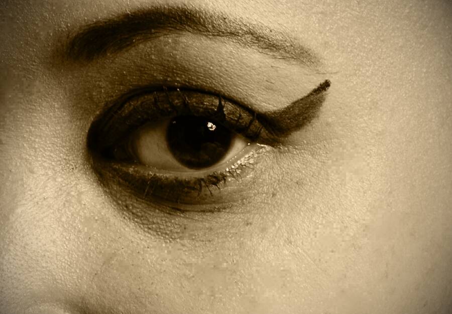 photographer Alan Tog body modelling photo. close up of the models eye changed to an old photo bw filter.